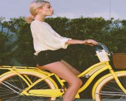 She loves to ride a bike and ride her yellow bike whenever she finds time to ride it.